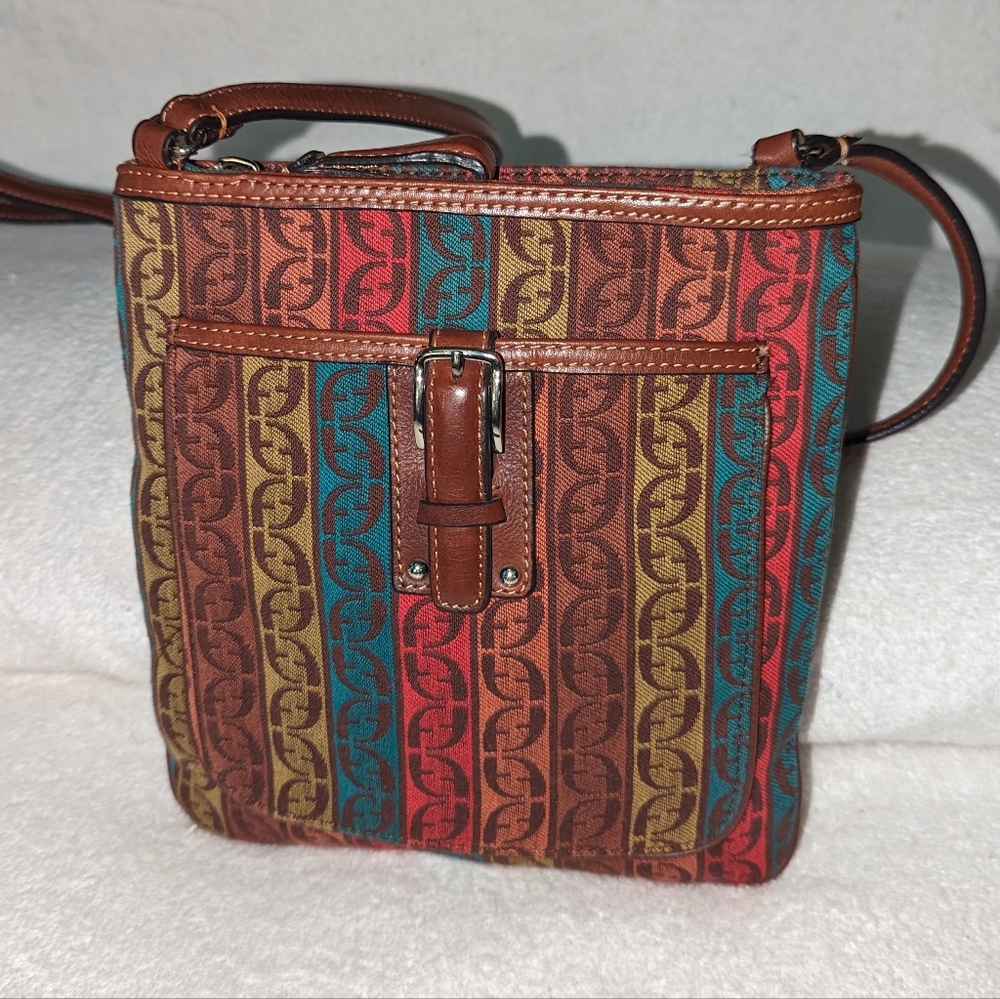 Fossil  multicolor canvas with leather trim and strap.